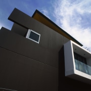 An exterior view of the paints used on architecture, building, daylighting, daytime, elevation, facade, home, house, line, property, siding, sky, window, black