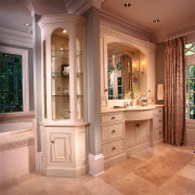 The bathroom has many vanities and four perfumeries. bathroom, bathroom accessory, bathroom cabinet, cabinetry, countertop, cuisine classique, estate, floor, home, interior design, room, window, orange, brown