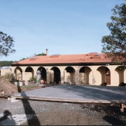 Origional Hacienda-style house prior to the renovations using building, estate, facade, hacienda, historic site, house, property, real estate, villa, teal, black