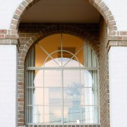 A view of a home designed by Domaine arch, architecture, brickwork, daylighting, facade, structure, window, white, brown