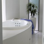 view of this bathroom featuring recessed jet spa angle, bathroom, bathroom accessory, bathroom cabinet, bathtub, plumbing fixture, product design, tap, toilet seat, gray