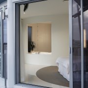 view of the large cutout window in the architecture, door, house, interior design, window, gray