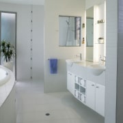 view of the bathroom featuring white tiled flooring, bathroom, bathroom accessory, bathroom cabinet, floor, home, interior design, plumbing fixture, product design, room, sink, tap, gray