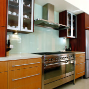 A view of a kitchen with Omega Smeg cabinetry, countertop, cuisine classique, furniture, interior design, kitchen, room, gray, brown