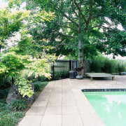 sandstone pavers surround the pool, planting connects the backyard, courtyard, estate, garden, grass, home, house, landscape, landscaping, lawn, outdoor structure, plant, property, real estate, tree, walkway, yard, green