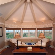 Octagonal sitting room with vaulted ceiling, wicker furniture ceiling, daylighting, estate, home, interior design, living room, real estate, room, shade, window, orange