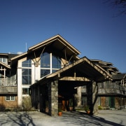 Exterior view of golf clubrooms with cedar cladding, architecture, building, cottage, facade, home, house, log cabin, real estate, residential area, sky, snow, winter, wood, blue, black