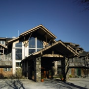 Exterior view of golf clubrooms with cedar cladding, architecture, building, cottage, facade, home, house, log cabin, real estate, residential area, sky, snow, winter, wood, blue, black