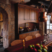 view of the dining area featuring oak table, fireplace, furniture, hearth, home, interior design, lighting, living room, room, black