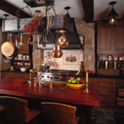 view of the kitchen island which features a cabinetry, countertop, dining room, furniture, home, interior design, kitchen, room, table, black