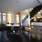 A view of the dining area, wooden flooring, apartment, architecture, ceiling, floor, flooring, furniture, interior design, living room, lobby, table, gray, black