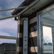 A view of the shower. - A view architecture, door, glass, structure, window, black, gray