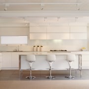 Examples of different two very different styles of architecture, ceiling, countertop, floor, flooring, furniture, interior design, kitchen, product design, table, wall, gray