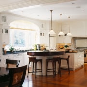 view of the kitchen  featuring large windows, cabinetry, ceiling, countertop, cuisine classique, dining room, floor, flooring, hardwood, home, interior design, kitchen, room, window, wood flooring, white