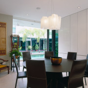 view of the dining area featuring dark stained ceiling, dining room, interior design, property, real estate, room, table, window, gray