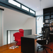 view of this medroom and study area featuring architecture, ceiling, desk, floor, flooring, furniture, interior design, loft, office, gray