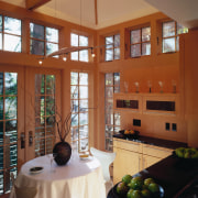 A view of the kitchen and dining areas, architecture, ceiling, home, house, interior design, living room, real estate, room, window, wood, brown