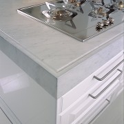 Closeup view of white Carrara benchtop with edge chest of drawers, countertop, drawer, floor, furniture, kitchen, product design, sink, table, tap, gray