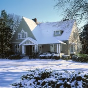 This century old home was remodelled  using building, cottage, estate, facade, farmhouse, freezing, home, house, log cabin, mansion, neighbourhood, property, real estate, residential area, siding, snow, suburb, tree, winter, teal, black
