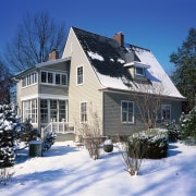 Maintaining the historic aspect of this home was building, cottage, estate, facade, farmhouse, freezing, home, house, log cabin, neighbourhood, property, real estate, residential area, roof, siding, sky, snow, suburb, tree, window, winter, blue