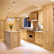 The robust building techinques used on this classic cabinetry, countertop, cuisine classique, interior design, kitchen, room, orange