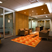 A view of the reception area in an ceiling, conference hall, floor, flooring, interior design, lobby, office, brown