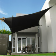 A view of a shade system. - A architecture, facade, house, shade, gray
