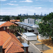 Overhead view of roofs at the Athletes' Village architecture, city, home, house, neighbourhood, outdoor structure, real estate, residential area, roof, sky, suburb, tree, white