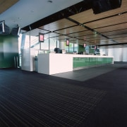 Large foyer lounge area at the MCG with architecture, daylighting, floor, flooring, glass, interior design, structure, black