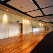 Large function room with maple walll panelling and architecture, ceiling, daylighting, floor, flooring, function hall, hardwood, interior design, laminate flooring, light, lighting, lobby, wood, wood flooring, brown, orange