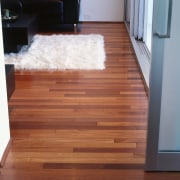 Lounge room with timber flooring, white rug and floor, flooring, hardwood, interior design, laminate flooring, stairs, wood, wood flooring, wood stain, red