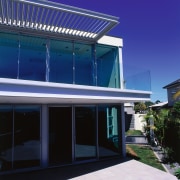 view of the townhouse, the motorised alluminium louvres architecture, building, commercial building, corporate headquarters, daylighting, elevation, facade, home, house, property, real estate, residential area, roof, sky, window, blue, black