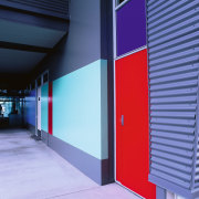 Bright red, blues and neutral colours were used architecture, blue, door, line, structure, blue