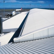 View of Dimond V-rib roof at airport. - architecture, automotive exterior, daylighting, fixed link, line, outdoor structure, roof, sky, structure, gray
