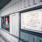 View of building's fire protection panels and schematic building, window, gray, white