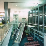 View of airport with mezzanine floor, stairs and glass, leisure centre, metropolitan area, structure, gray