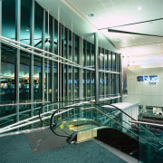 Escalator in large airport building, with extensive glazing architecture, building, condominium, daylighting, glass, leisure centre, metropolitan area, black