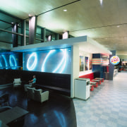 Burger King store with seating and lighting display. interior design, lobby, black