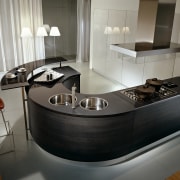 A view of a Pedini kitchen, with curved countertop, furniture, interior design, kitchen, product design, gray, black