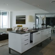 Kitchen with white cabinetry and black benchtop, and countertop, floor, flooring, interior design, kitchen, gray, black