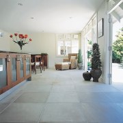 Kitchen and dining area with cream sandstone paver apartment, daylighting, estate, floor, flooring, house, interior design, lobby, property, real estate, tile, wood flooring, gray