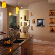 view of this kitchen featuring walnut coliseum Stone, cabinetry, ceiling, countertop, floor, flooring, hardwood, home, interior design, kitchen, lighting, room, wood flooring, brown