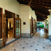 rooms open out to the covered terraces - floor, flooring, interior design, lobby, brown, gray