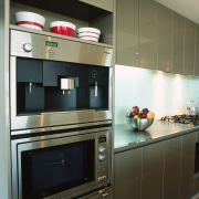 View of this kitchen featuring a Miele stainless cabinetry, countertop, cuisine classique, home appliance, interior design, kitchen, kitchen appliance, kitchen stove, major appliance, oven, refrigerator, room, shelf, black, brown