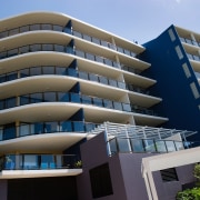 A view of an apartment complex with Kleenmaid apartment, architecture, building, commercial building, condominium, corporate headquarters, daytime, elevation, facade, headquarters, hotel, house, metropolitan area, mixed use, property, real estate, residential area, sky, tower block