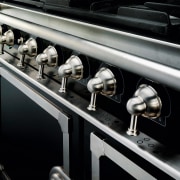 Closeup view of cooker control handles. - Closeup automotive design, car, metal, motor vehicle, black, gray