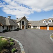 Exterior view of two storey home with shingle asphalt, cottage, driveway, elevation, estate, facade, farmhouse, home, house, landscape, neighbourhood, property, real estate, residential area, roof, siding, sky, suburb, window, gray