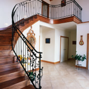 View of timber stairway with ornate steel balustrading, baluster, estate, floor, flooring, handrail, hardwood, home, house, property, real estate, stairs, wood, wood flooring, gray