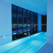 the freshwater place tower features a pool on architecture, azure, blue, ceiling, daylighting, glass, interior design, leisure, leisure centre, light, lighting, sky, swimming pool, window, teal