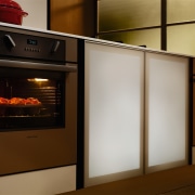 A view of some Fisher &amp; Paykel appliances. home appliance, kitchen, kitchen appliance, kitchen stove, major appliance, microwave oven, oven, brown